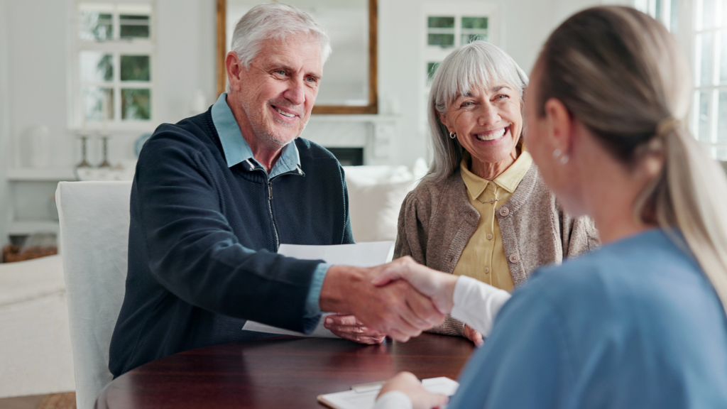 Couple reviewing workplace open enrollment benefits and financial options